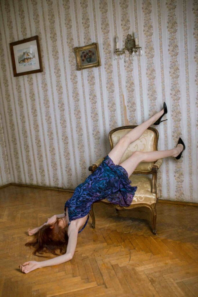 Model Weronika Siesicka in a Versace dress and Dior heels, photographed by Helena Bromboszcz in an editorial shoot.