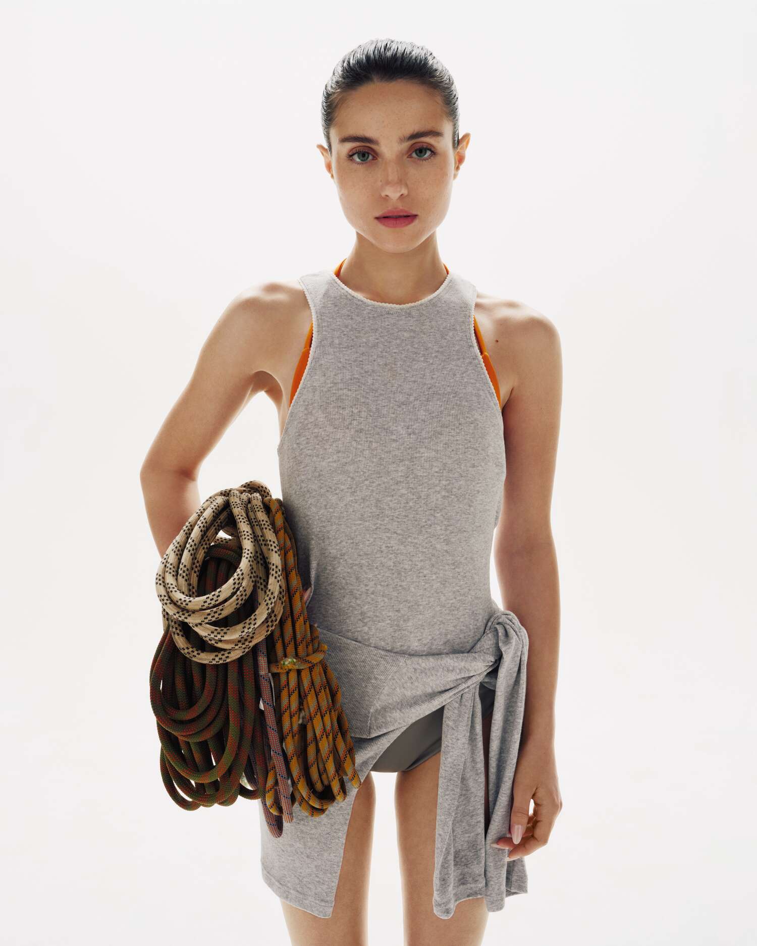 Madeleine Argy styled in grey athletic layers holding climbing rope in Samsøe Samsøe’s Pre-Autumn 2025 collection