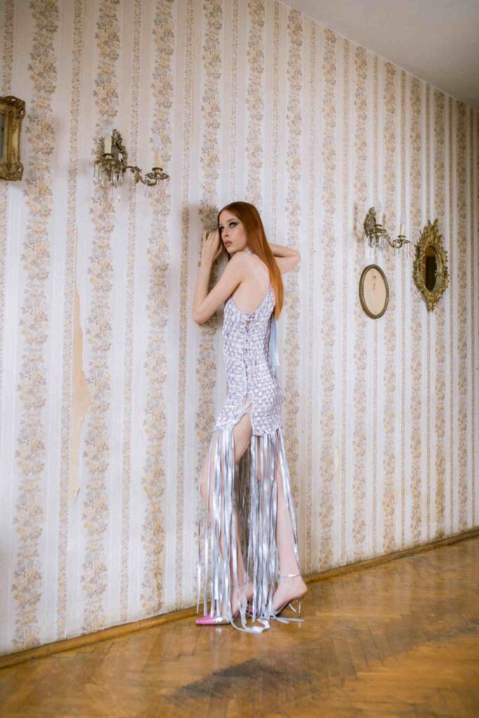 Model Weronika Siesicka wearing a dress by Magdalena Wilk-Dryło and Roberto Cavalli heels in a contemporary fashion shoot by Helena Bromboszcz.